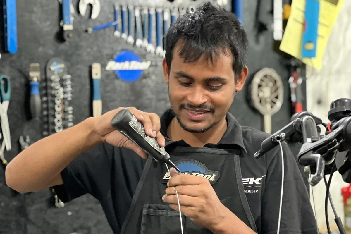 Yellow Jersey mechanics servicing a bicycle